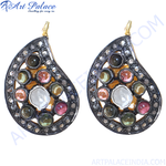 Load image into Gallery viewer, Multi-gemstone teardrop earrings with a silver frame, featuring various colorful gemstones and a gold hook.
