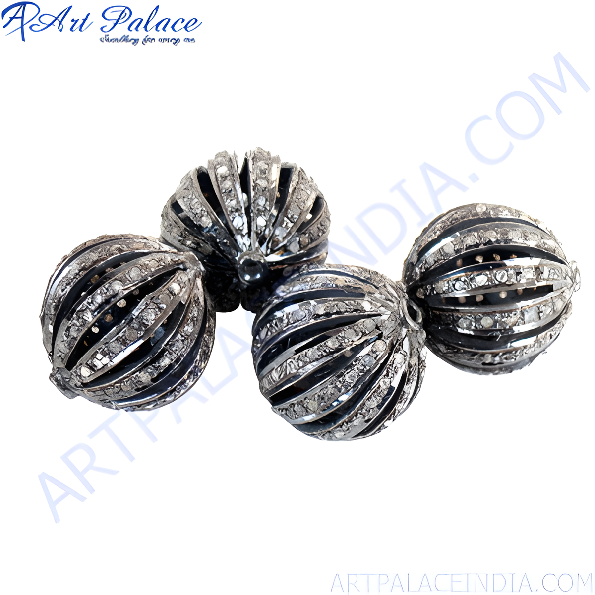 Close up of four oxidized silver bead charms with gemstone accents on a white background