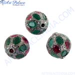 将图像加载到图库查看器中， Close-up of a silver pendant with round ruby and emerald gemstones, set in a beaded style.
