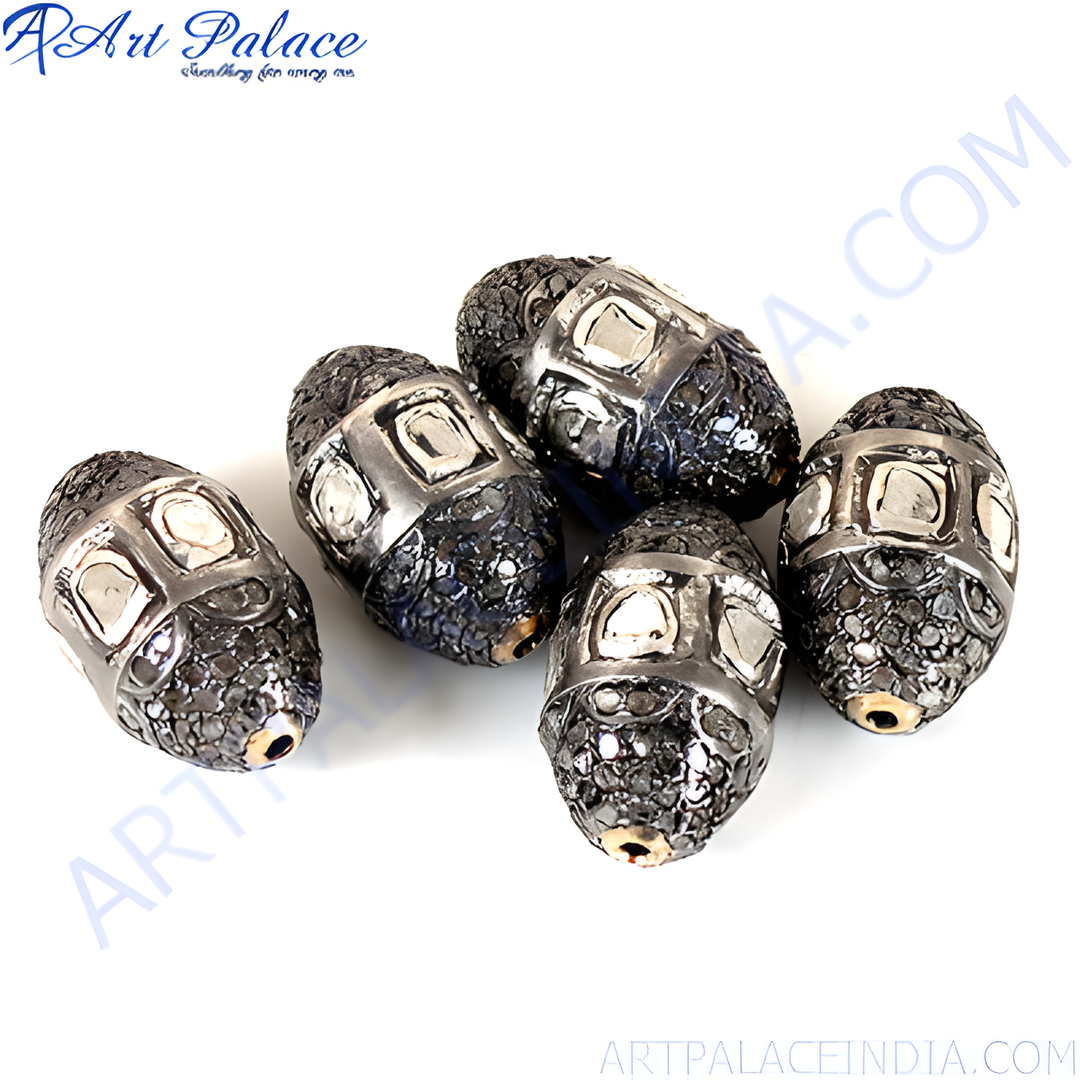 Close-up of beaded silver beads with sparkling diamond accents, perfect for jewelry design.