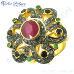 Load image into Gallery viewer, Gold plated cocktail ring with a central ruby and emerald accents in a flower design.
