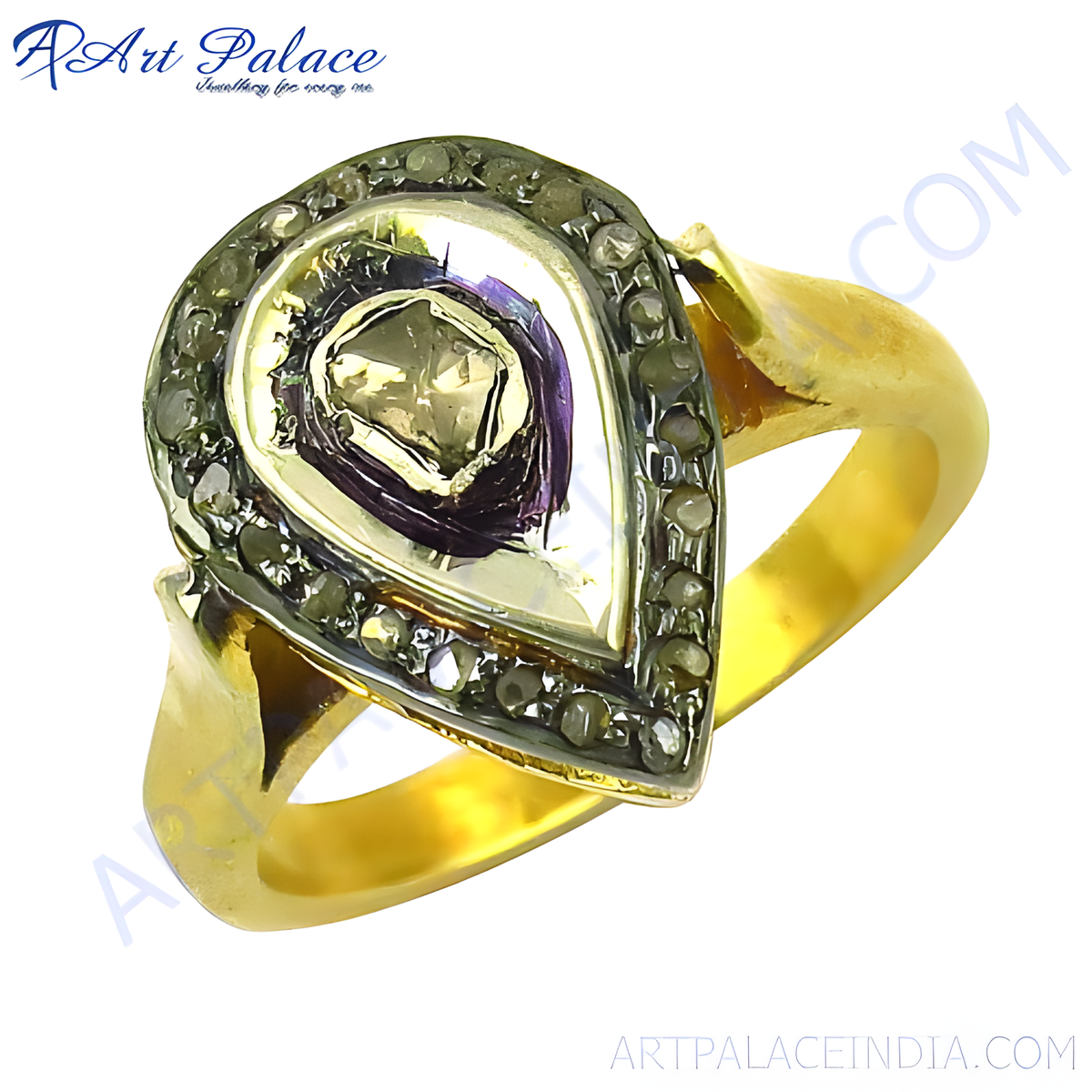 Gold plating pear shaped ring with a halo of diamonds around a gemstone center