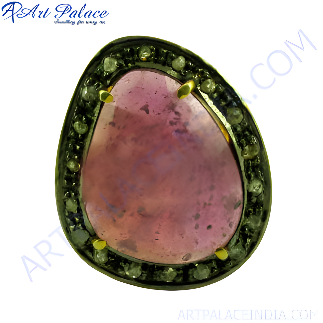 Sterling silver ring with a large pink tourmaline gemstone and diamond accents, a luxurious and eye-catching piece of jewelry.