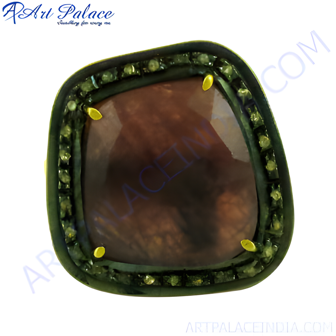 A close-up of a ruby gemstone ring with a dark red center stone and a halo of smaller gemstones on a white background