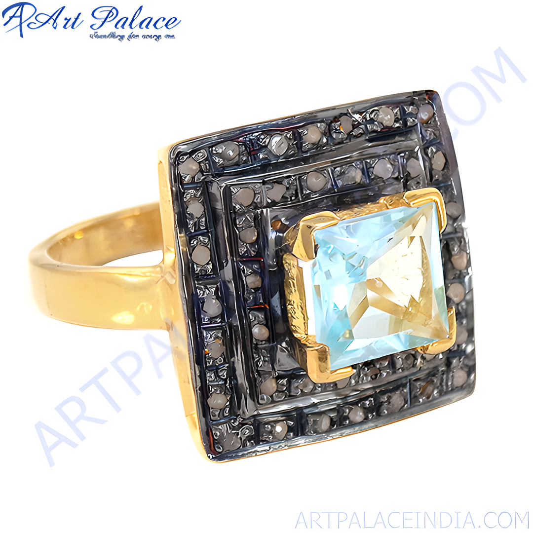 gold plating ring with a square blue topaz center stone and a halo of black diamonds, elegant jewelry.