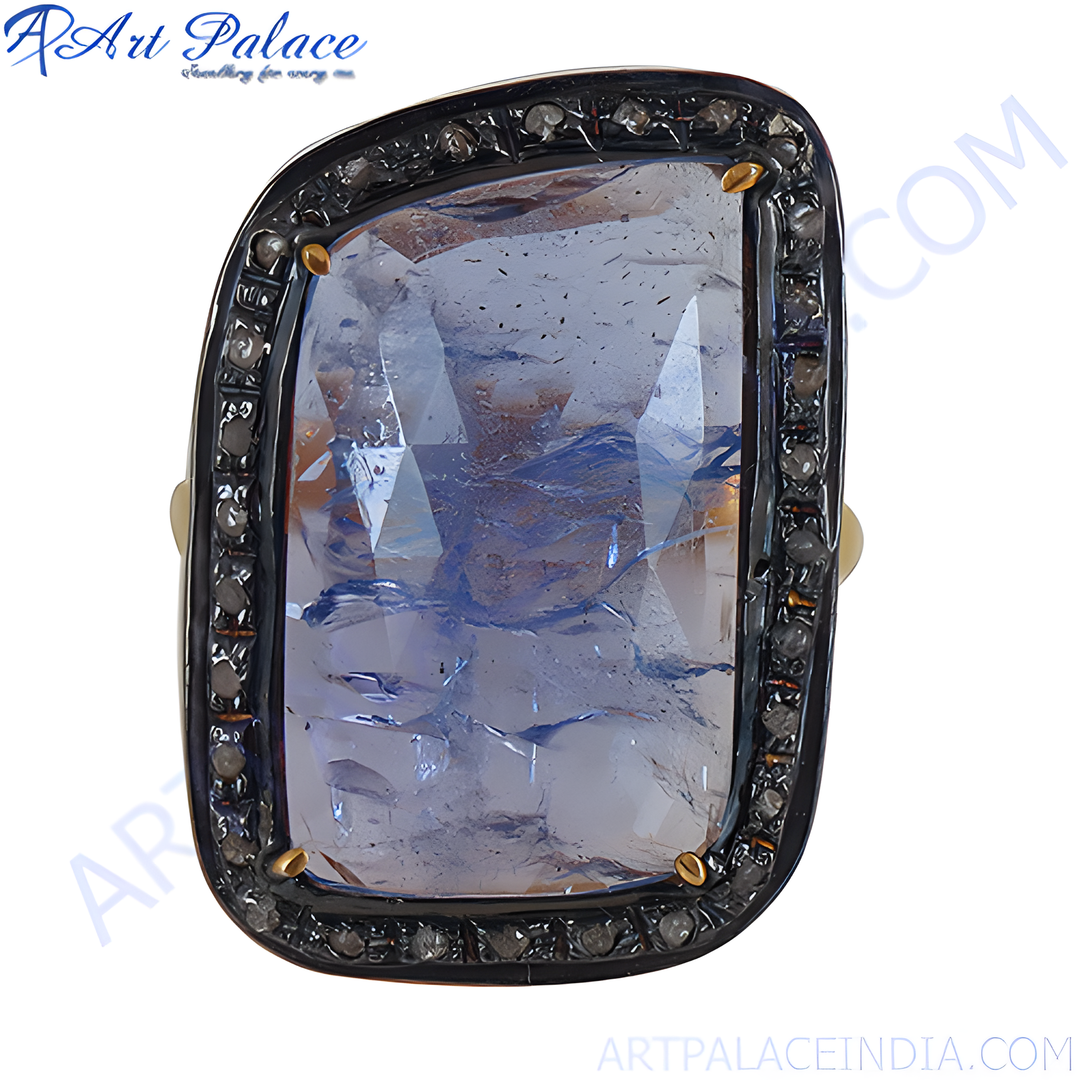 Blue sapphire and diamond ring with a unique gemstone design and black accents.