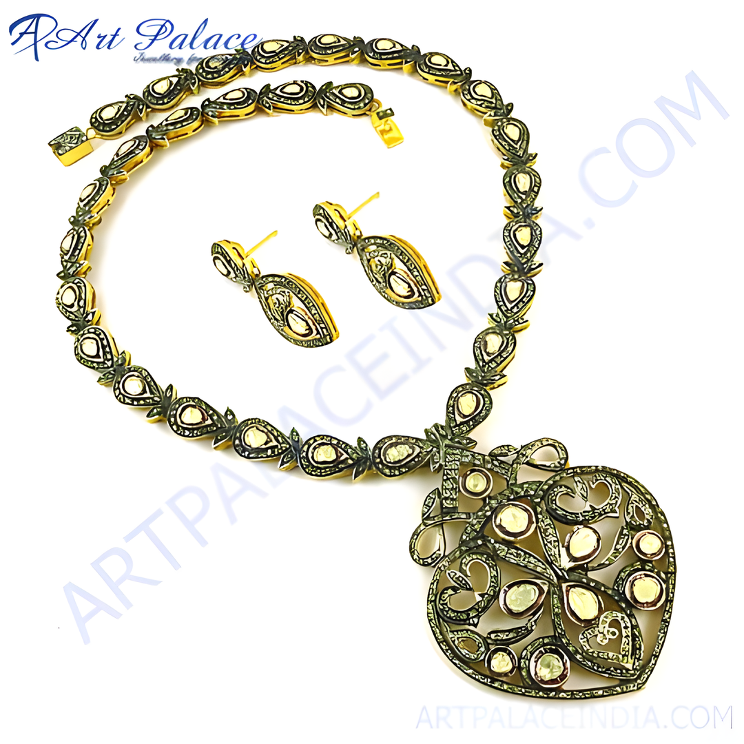 Gold filigree necklace and drop earrings set with intricate details, perfect for special occasions.