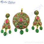 Load image into Gallery viewer, Silver pendant earrings set with ruby and emerald gemstones. Features a dangling design.
