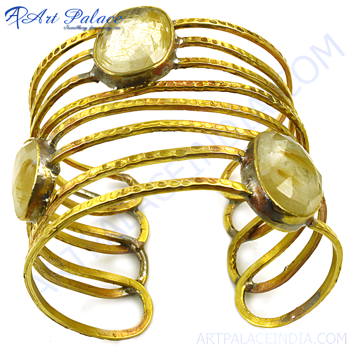 Gold toned metal cuff bracelet with rutilated quartz gemstones