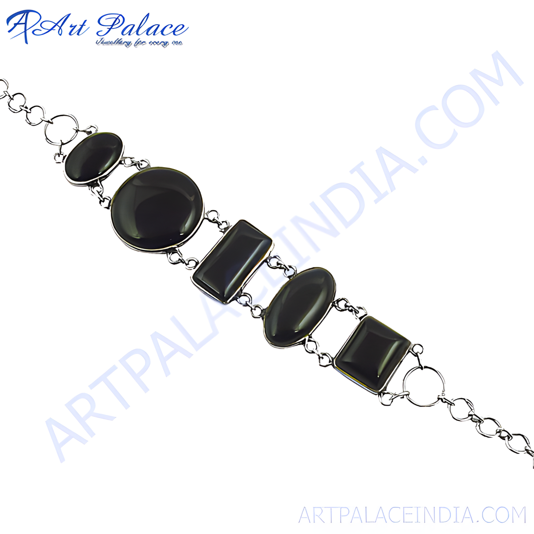 Sterling silver chain bracelet with oval, rectangle and round black onyx gemstones.
