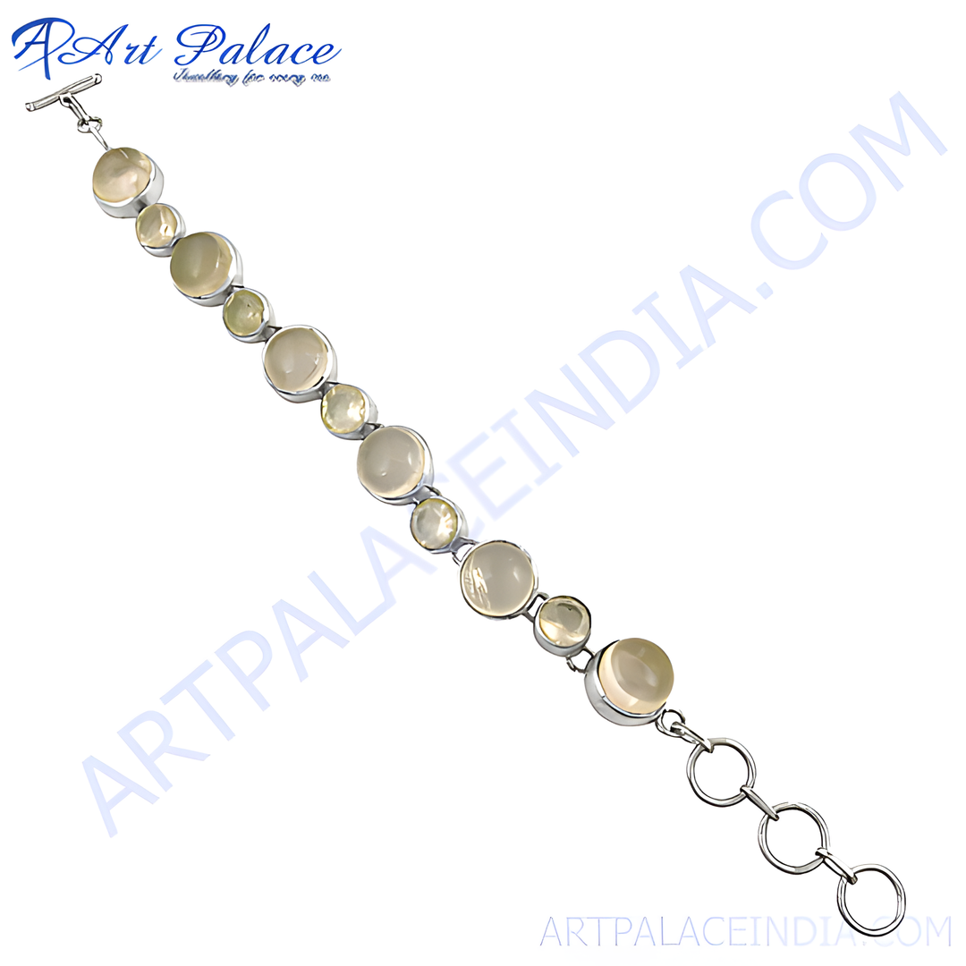 Sterling silver chain bracelet with round gemstones in silver bezel settings.