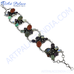 Load image into Gallery viewer, Sterling silver chain bracelet with various colorful gemstones. A stunning piece of jewelry.
