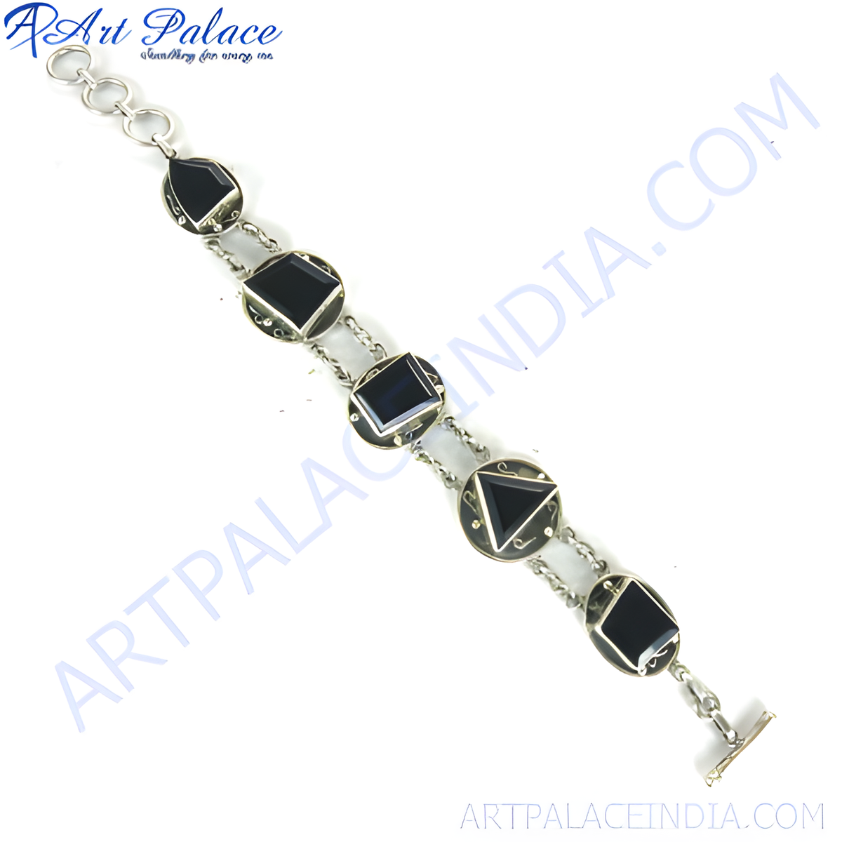 Sterling silver chain bracelet with various shaped black onyx stones, a toggle clasp, and a white background