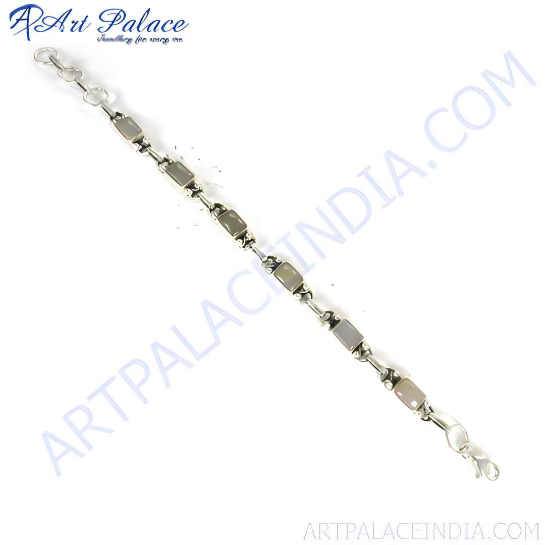 Silver chain bracelet with rectangular stone elements. Features a secure clasp and is perfect for daily wear.