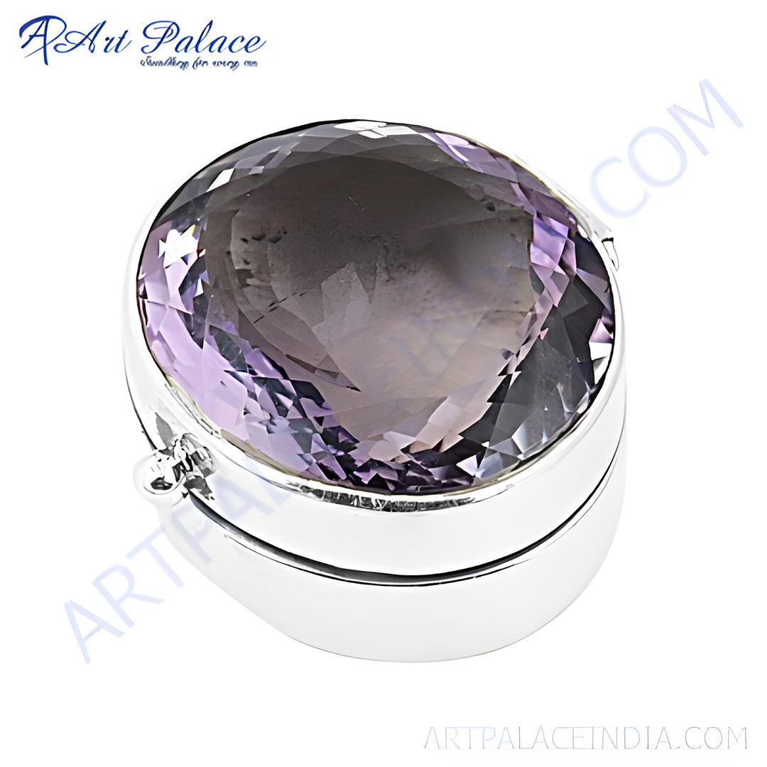 Sterling silver ring featuring a large, oval-cut amethyst gemstone. The ring is highly polished and suitable for any occasion.