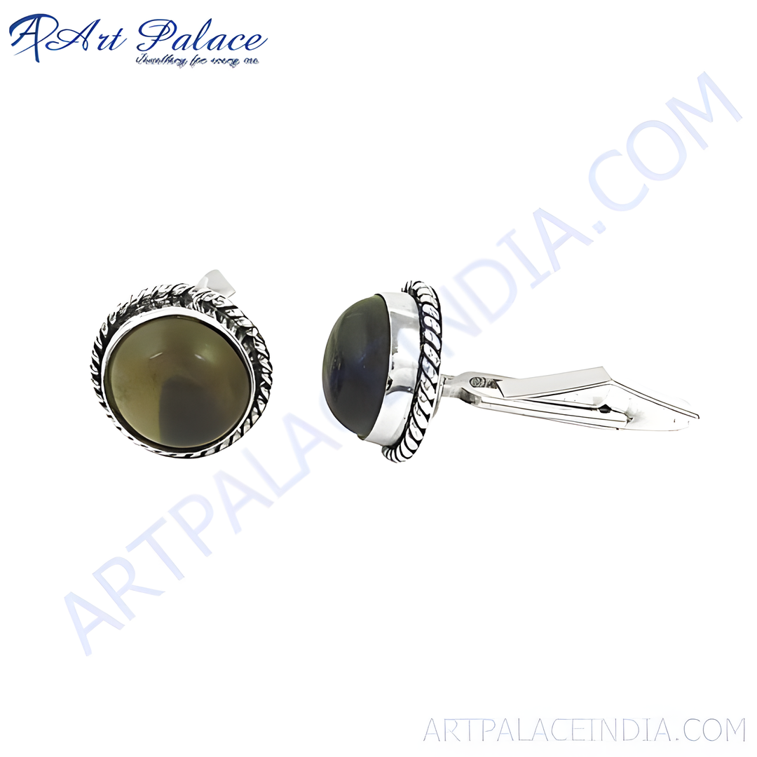 Silver cufflinks with a round gemstone center, perfect for formal wear.
