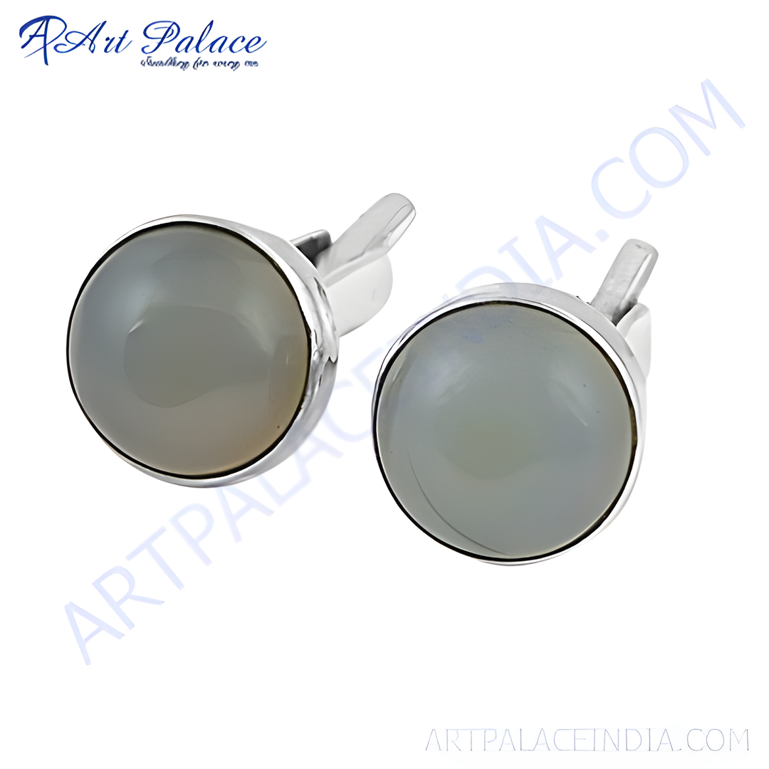 Silver cufflinks featuring round gray gemstones. Perfect for formal events and business wear. Classic and elegant design.
