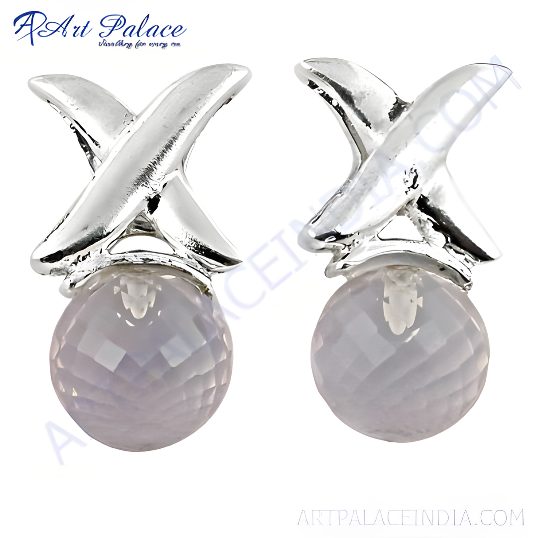 Sterling silver stud earrings with an X design and light-colored faceted gemstone. Elegant and stylish.