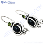 Load image into Gallery viewer, Sterling silver dangle earrings featuring black onyx gemstones and peridot accents, perfect for women's jewelry.
