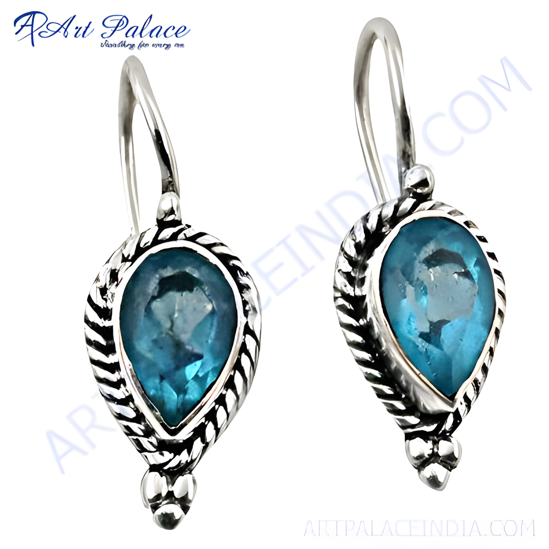 925 sterling silver teardrop earrings with a blue topaz gemstone center