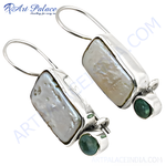 Load image into Gallery viewer, Sterling silver dangle earrings with large white pearl and small round emerald gemstones.
