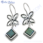 Load image into Gallery viewer, 925 sterling silver flower drop earrings with a labradorite gemstone and hook closure. The earrings display a vibrant green and blue color.
