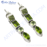 Load image into Gallery viewer, Sterling silver peridot drop earrings featuring vibrant green gemstones, perfect for any occasion.
