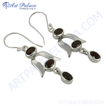 Load image into Gallery viewer, 925 sterling silver drop earrings with oval-cut red garnet gemstones.
