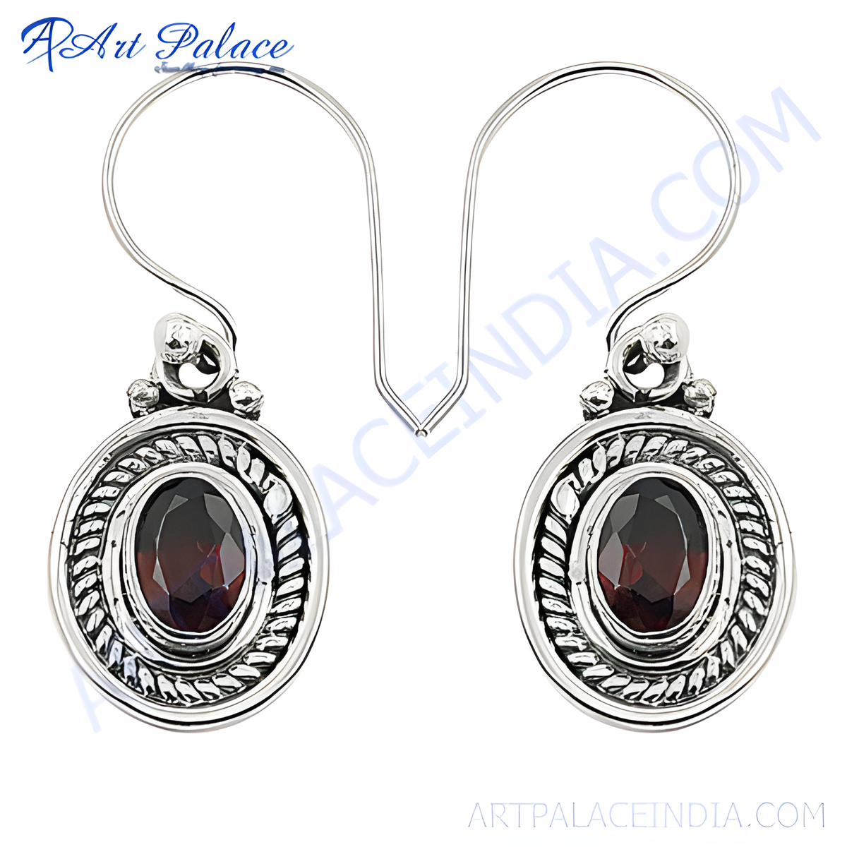 Sterling silver drop earrings featuring oval cut red garnet gemstones