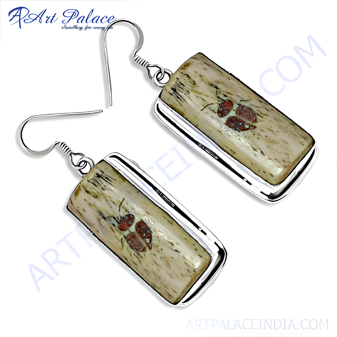 Sterling silver dangle earrings with rectangular stone detail and hook closure, perfect for any occasion.