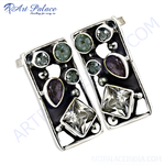 Load image into Gallery viewer, Geometric silver earrings featuring clear quartz and purple gemstones on a white background.
