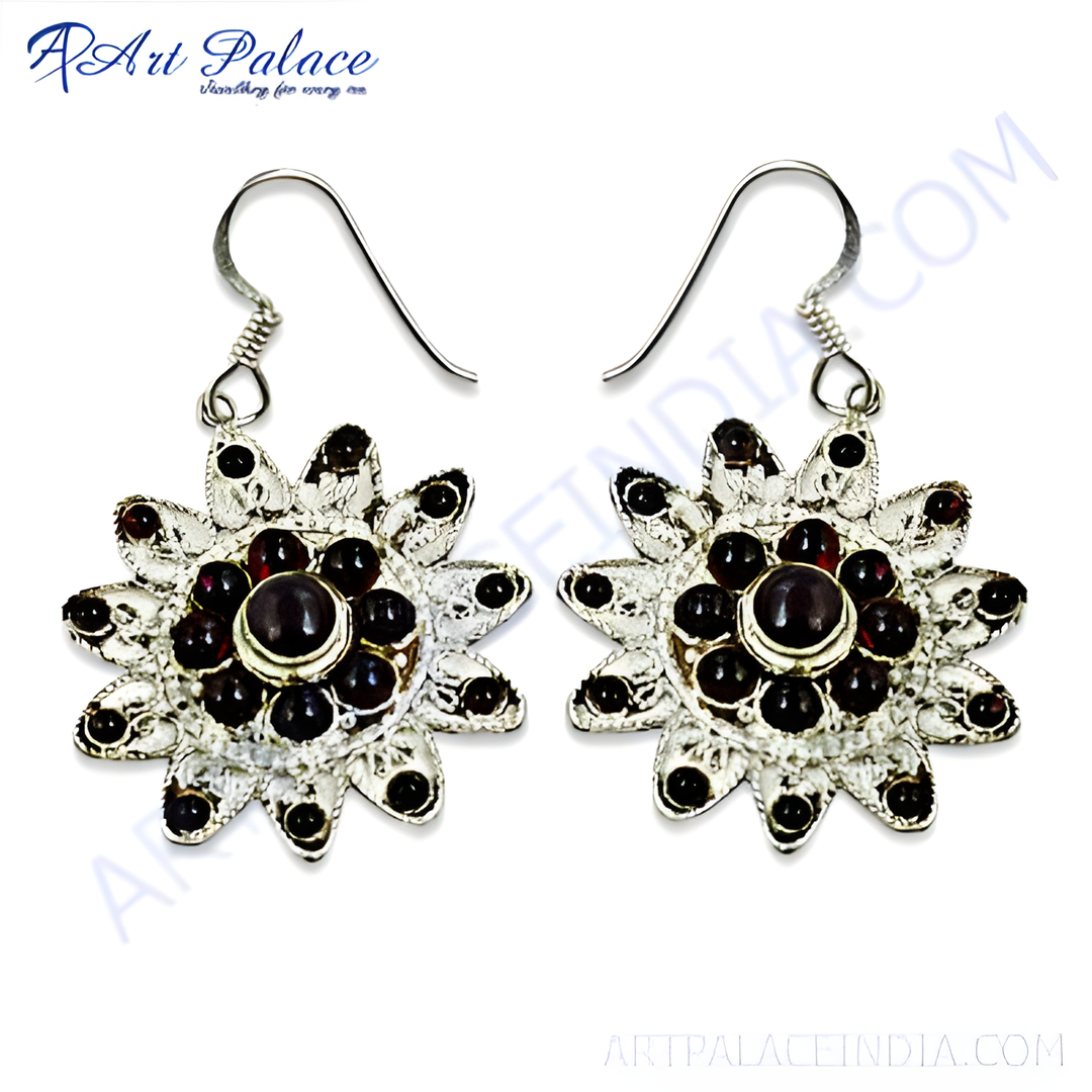925 Sterling silver dangle earrings featuring a flower design with red garnet gemstones.