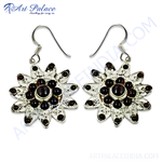 Load image into Gallery viewer, 925 Sterling silver dangle earrings featuring a flower design with red garnet gemstones.
