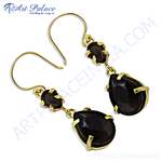 Load image into Gallery viewer, Gold plated dangle earrings with black onyx teardrop gemstones.
