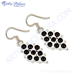 Load image into Gallery viewer, 925 sterling silver drop earrings with a cluster of round, deep red garnet gemstones.
