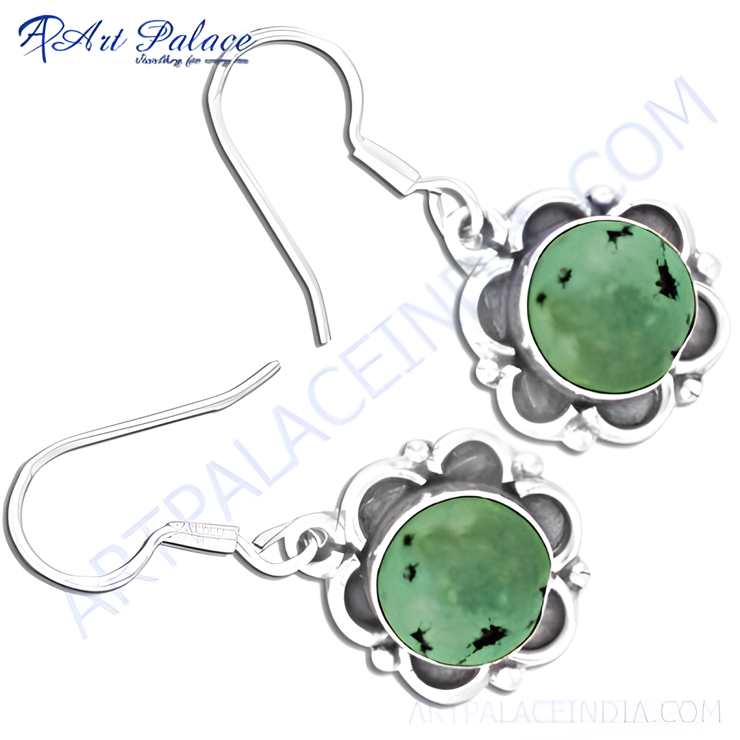 Sterling silver dangle earrings with round turquoise stones and a floral design, perfect for women.
