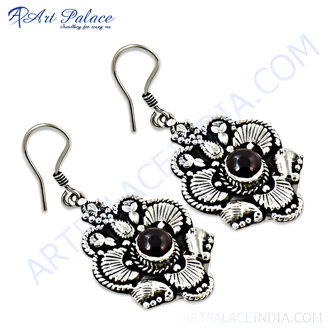 925 sterling silver drop earrings with garnet gemstones in a floral design.