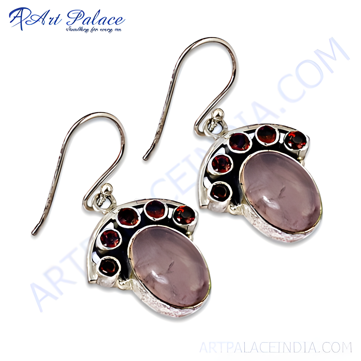 925 sterling silver dangle earrings with a large rose quartz gemstone and accented by smaller red garnet gemstones