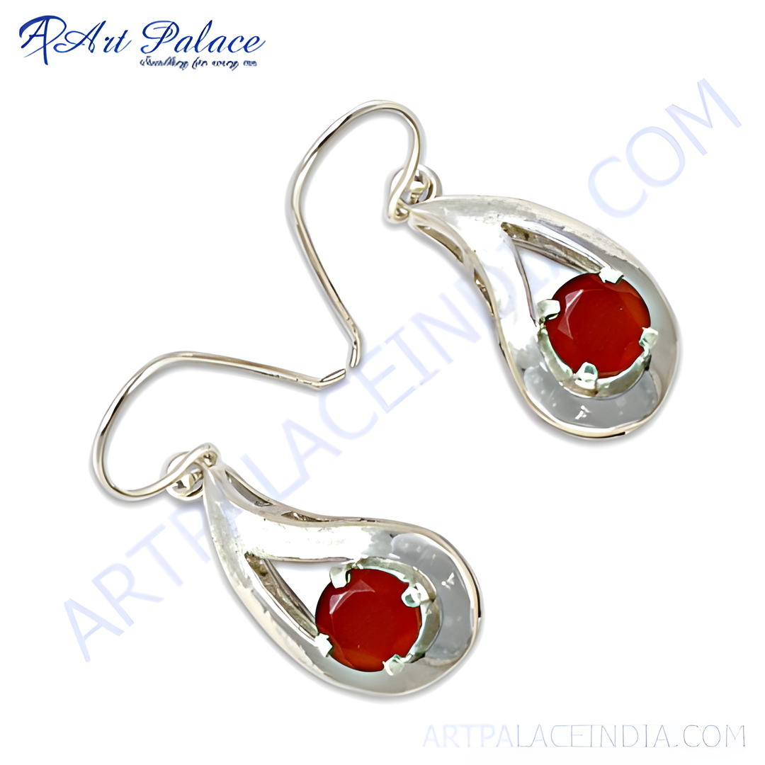 Sterling silver dangle earrings with teardrop design and red carnelian gemstone.