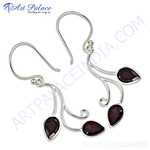 Load image into Gallery viewer, 925 sterling silver drop earrings with teardrop-shaped dark red garnet gemstones.
