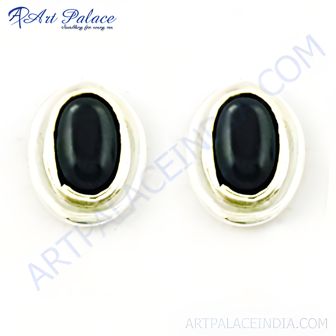 Sterling silver stud earrings with a black oval-shaped onyx gemstone.