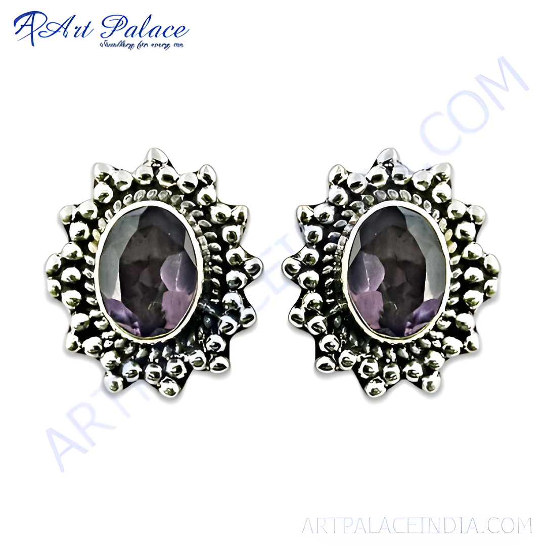 925 sterling silver stud earrings with oval amethyst gemstones and ornate silver detailing.