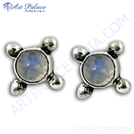 Load image into Gallery viewer, 925 Sterling Silver stud earrings with a round, blue moonstone center and four-pronged setting.
