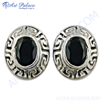 Load image into Gallery viewer, 925 sterling silver stud earrings with oval-shaped black gemstone.
