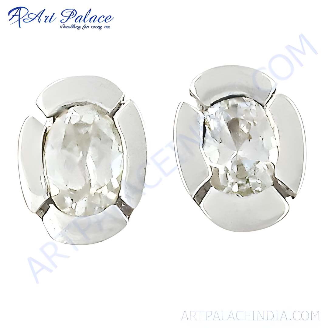 Oval cut diamond stud earrings set in silver flower design, featuring sparkling white gemstones.