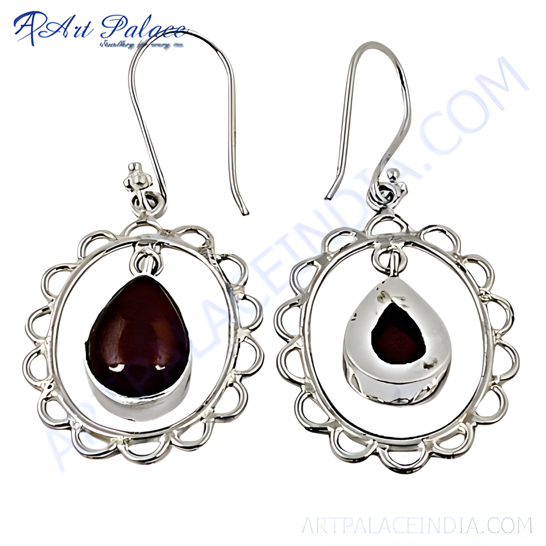 925 sterling silver dangle earrings featuring teardrop garnet gemstones.