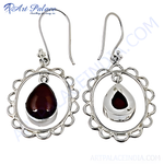 Load image into Gallery viewer, 925 sterling silver dangle earrings featuring teardrop garnet gemstones.

