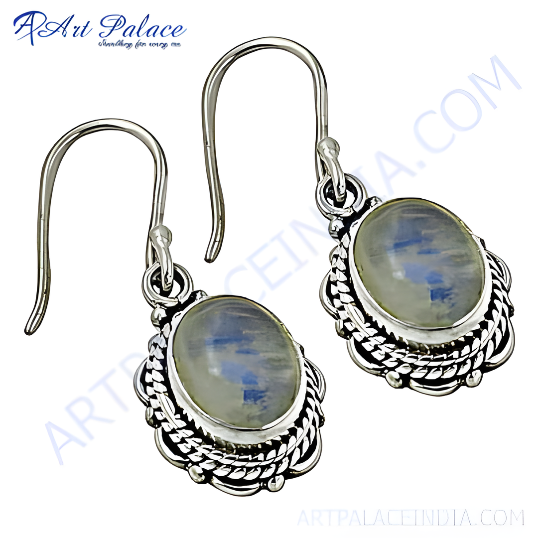 Sterling silver dangle earrings with oval moonstone gemstones and an intricate design, perfect for women's jewelry.
