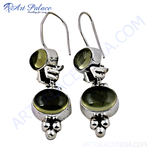 Load image into Gallery viewer, Sterling silver drop earrings with green gemstones, showcasing an elegant design.
