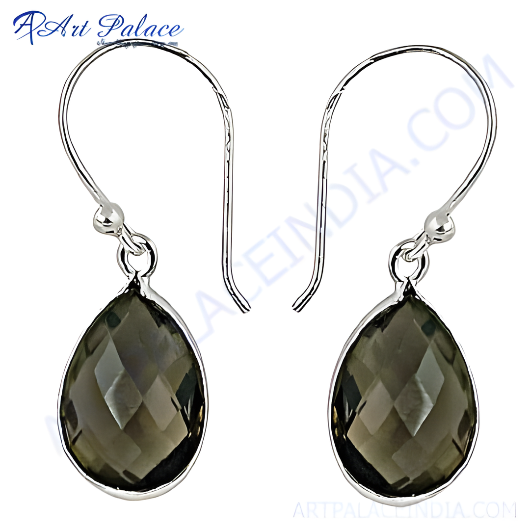 Sterling silver dangle earrings with teardrop-shaped smoky quartz gemstones. Elegant and stylish women's jewelry.